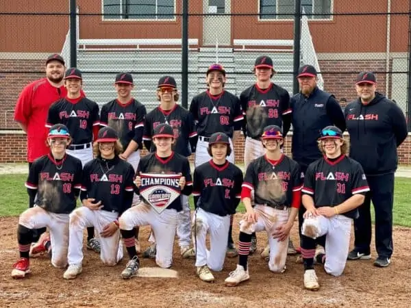 14U Flash baseball team with coaches holding Gameday championship home plate