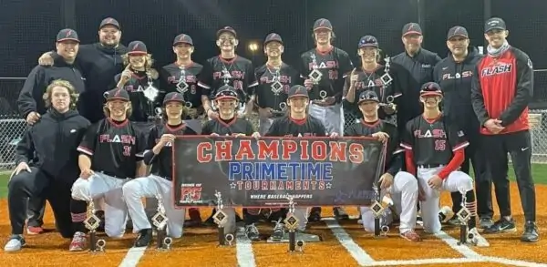 14 U boys Flash baseball team and coaches holding trophies and a Primetime Tournaments Champions banner