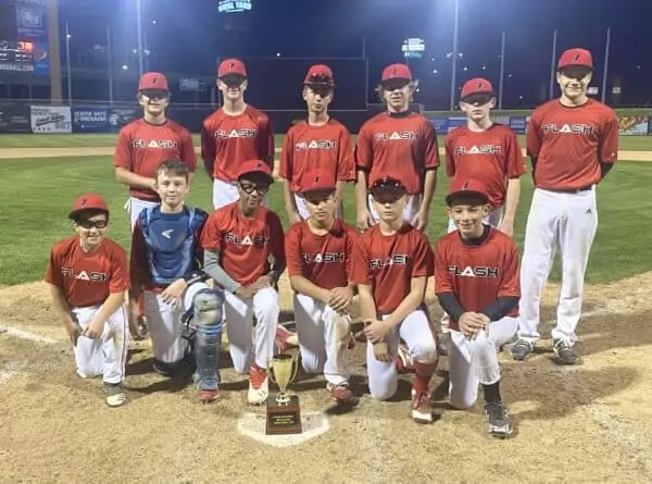 14U Red Flash baseball Team kneeling in front of the Red/Black trophy cup