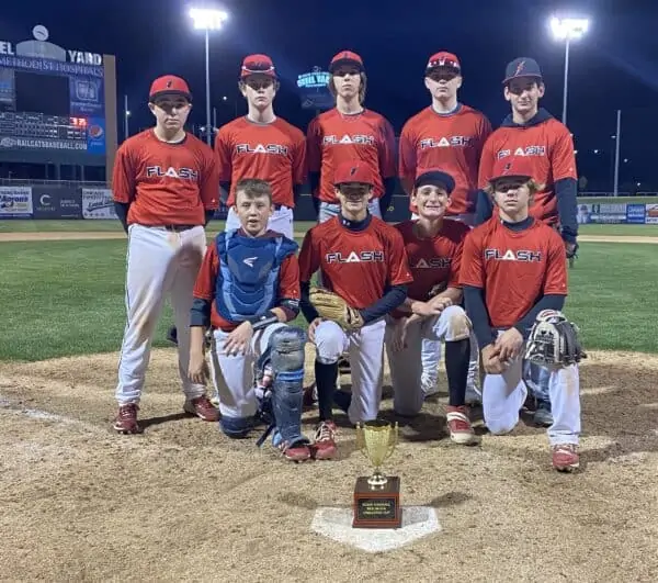 16U Red Flash baseball Team kneeling in front of the Red/Black trophy cup
